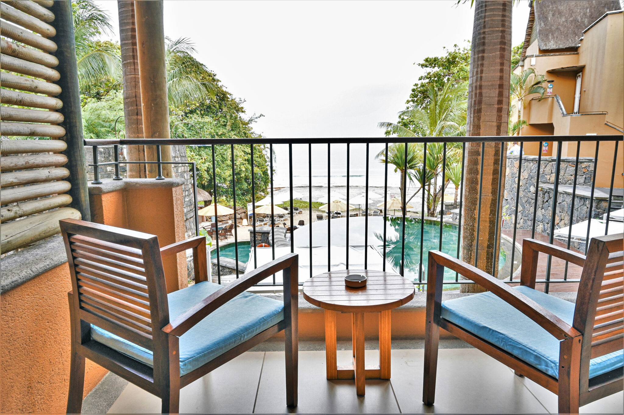 Balcony with chairs and table at Tamarina Golf & Spa Boutique Hotel