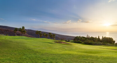 Fairway with bunker and trees around at Tecina Golf with ocean view