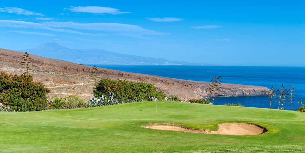 Hole with bunker and ocean in background at Tecina Golf