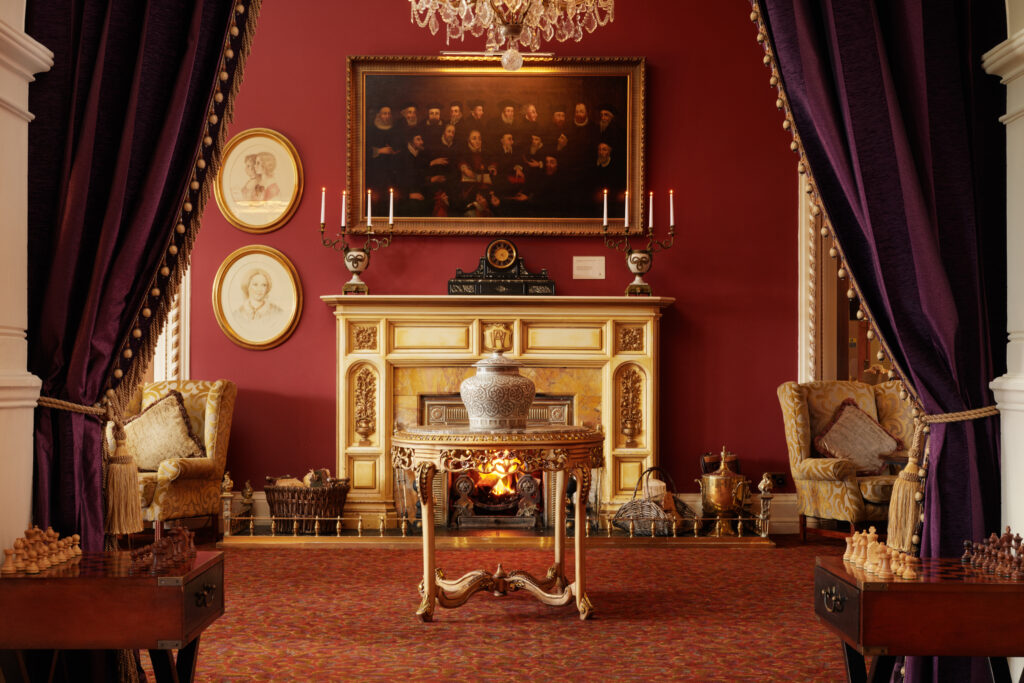 Indoor seating area with chess boards at The Culloden Estate & Spa