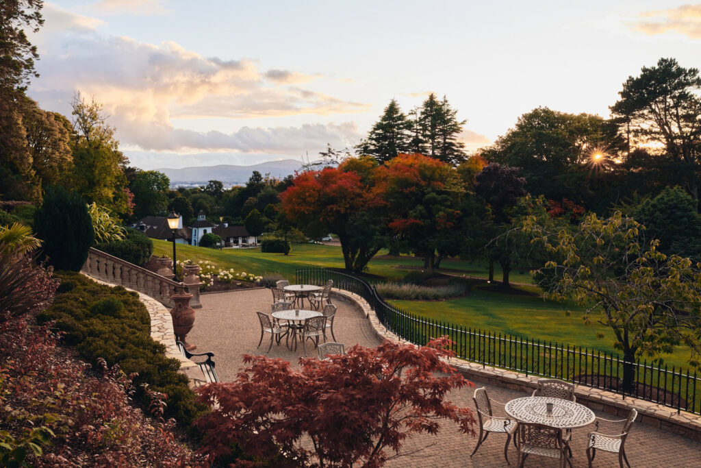 Outdoor seating area at The Culloden Estate & Spa with trees around