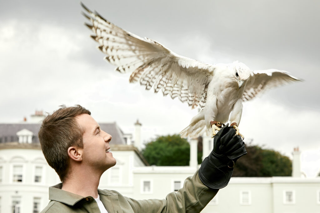 Man holding a bird at The K Club Hotel