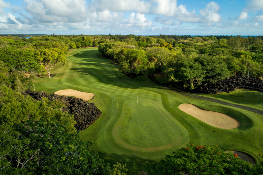 Hole with bunkers at The Legend Golf Course with trees around