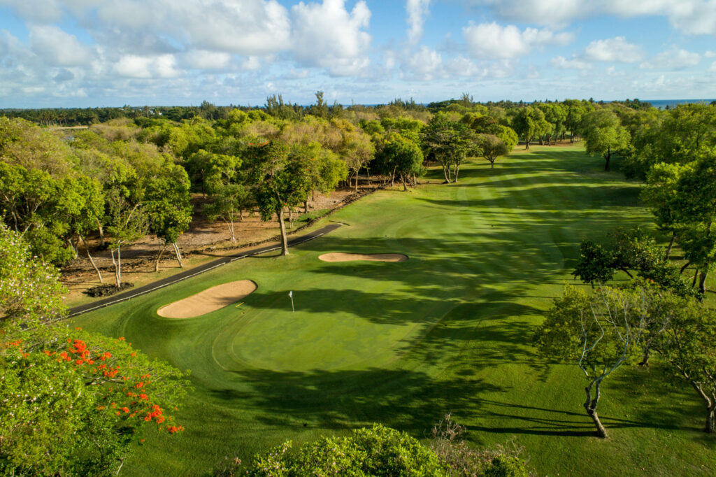 Hole with bunkers at The Legend Golf Course with trees around