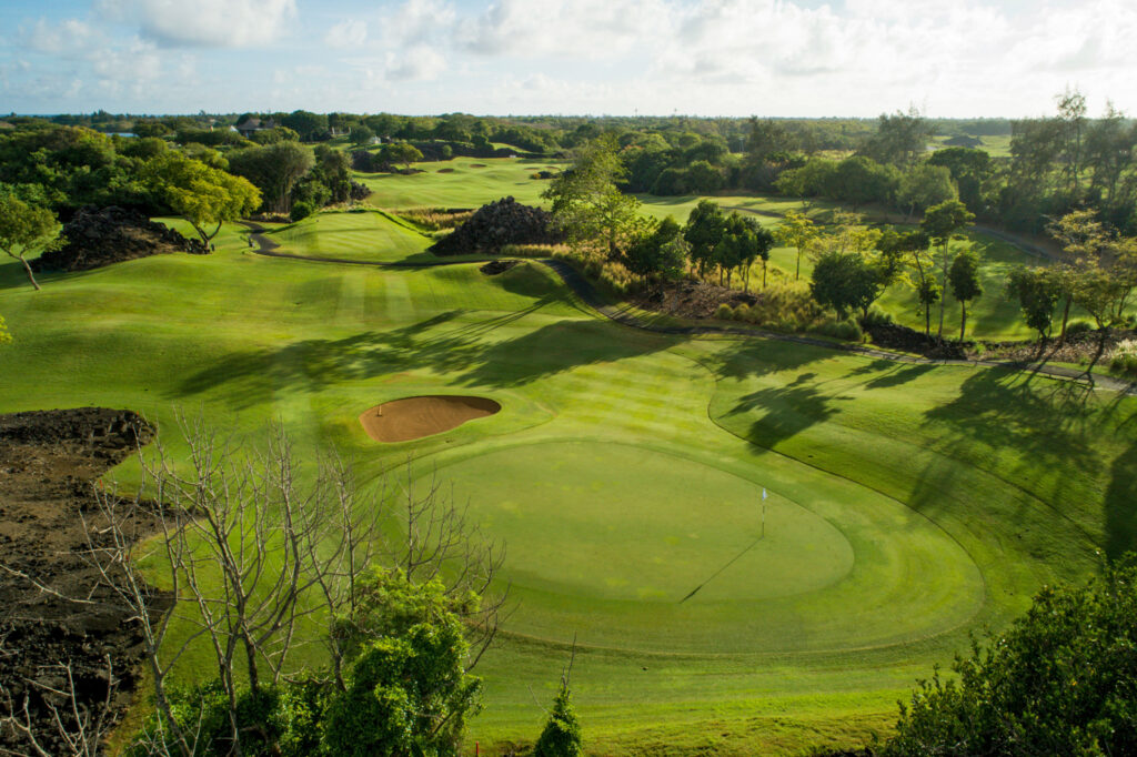 Hole with white flag at The Links Golf Course with trees around