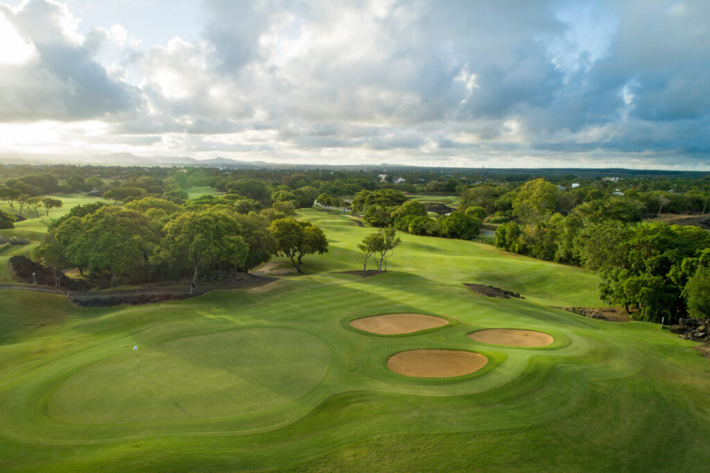 Hole with white flag at The Links Golf Course with bunkers