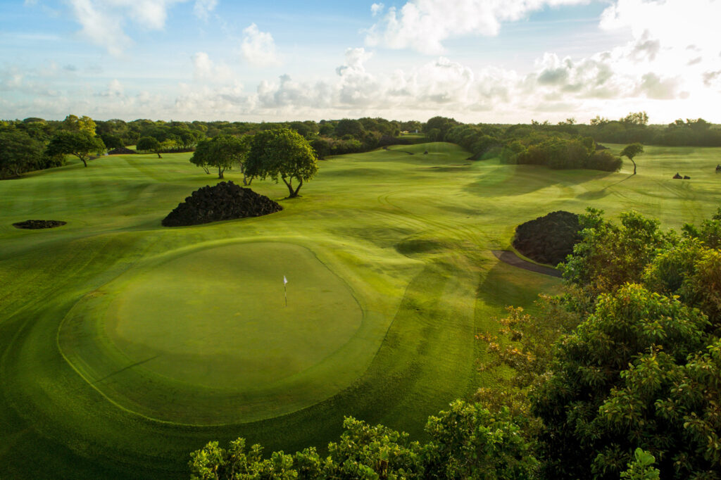 Hole with white flag at The Links Golf Course with trees around