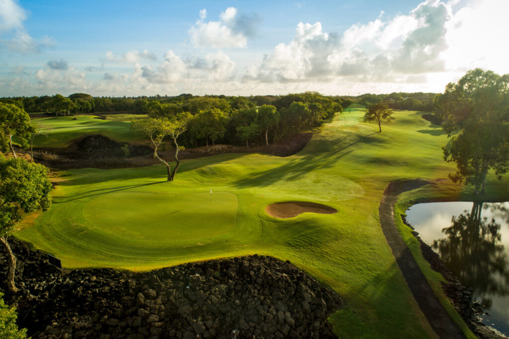 Hole with white flag at The Links Golf Course with trees around