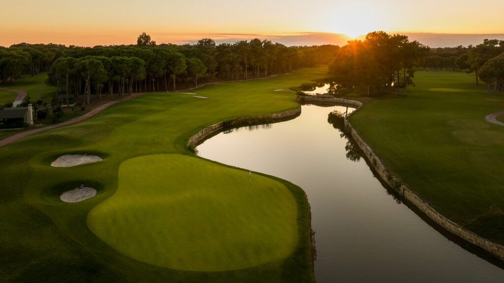 Fairway with lake and bunkers with trees around at The National Golf Course