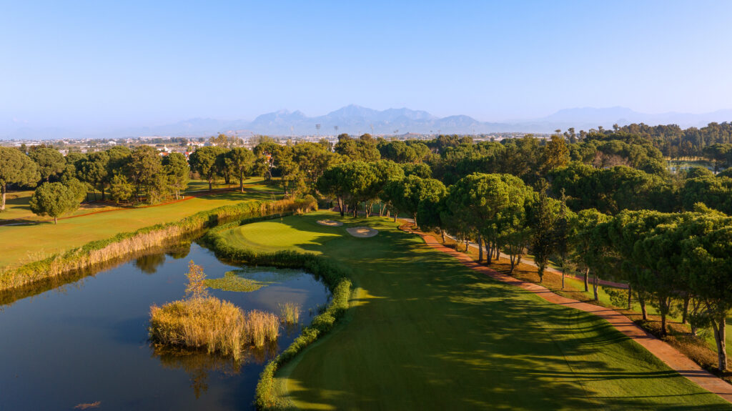 Fairway with lake and trees around at The National Golf Course