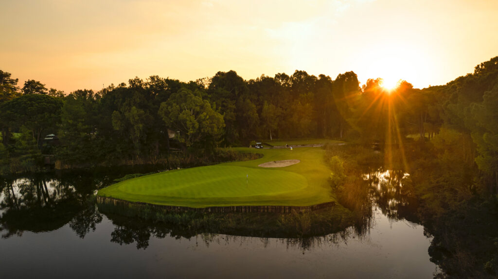 Hole with lake and trees around at The National Golf Course