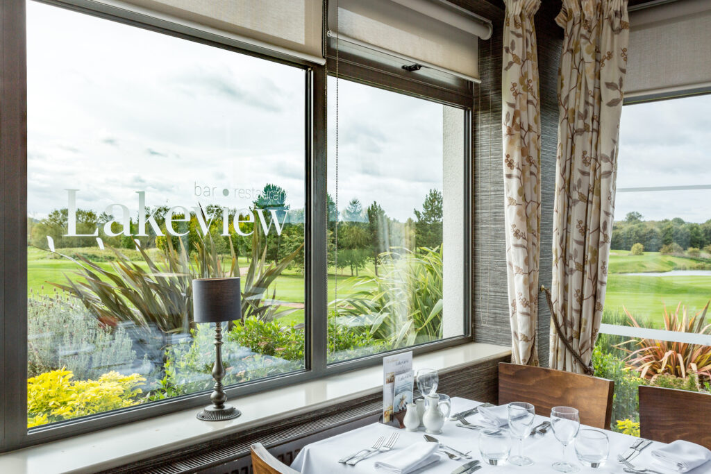 Indoor dining with golf view of The Nottinghamshire Golf & Country Club