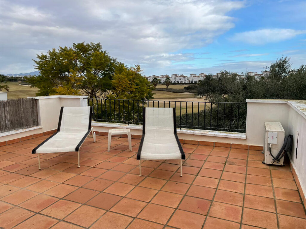 Sun loungers on terrace at The Residences at La Torre