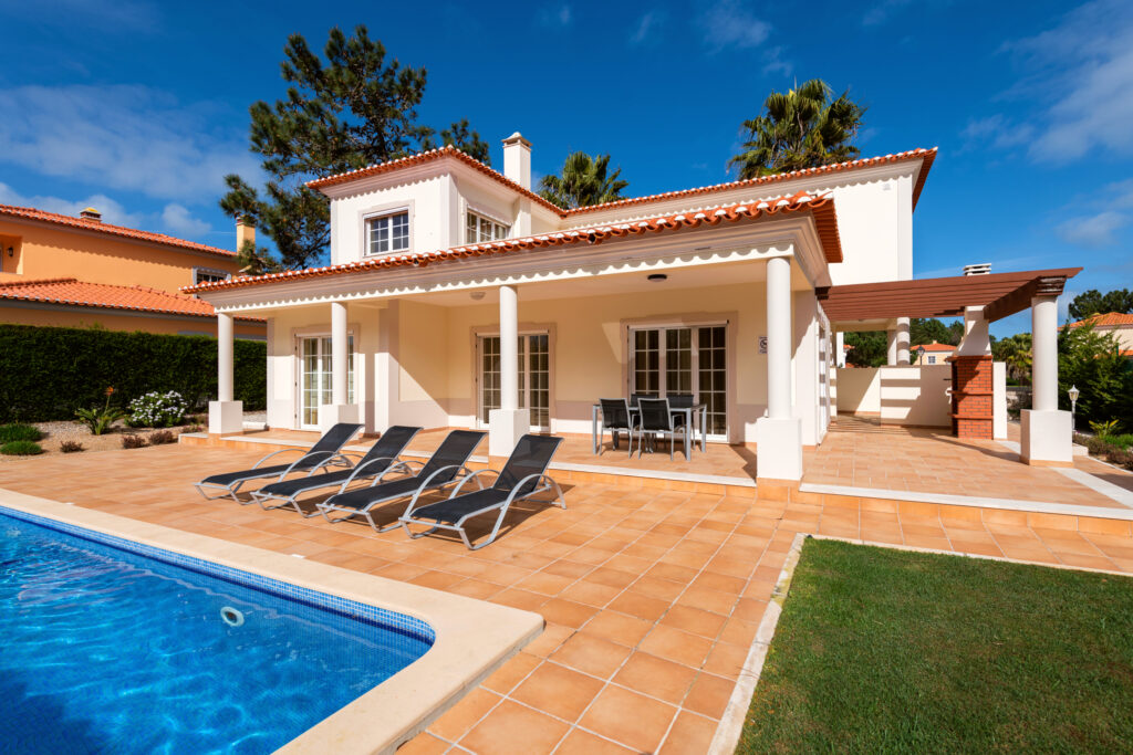 Exterior of the villa and outdoor pool at Praia d’el Rey - The Village Resort