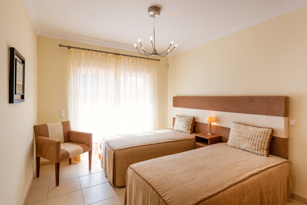 Twin bed accommodation at Praia d’el Rey - The Village Resort
