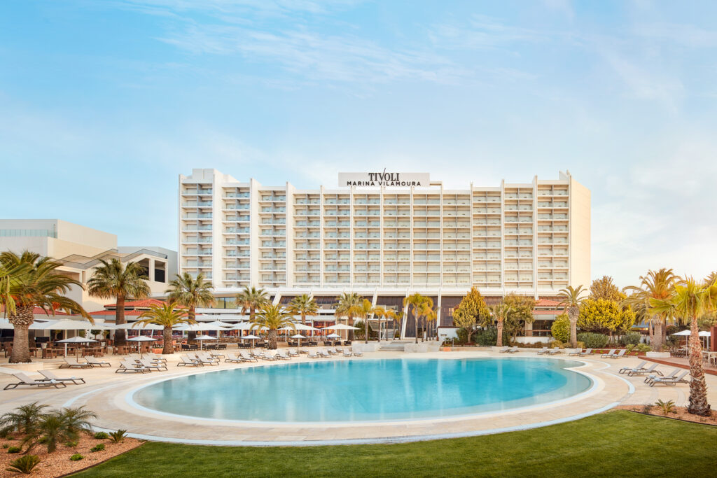 View of Tivoli Marina Vilamoura Hotel with outdoor pool and palm trees