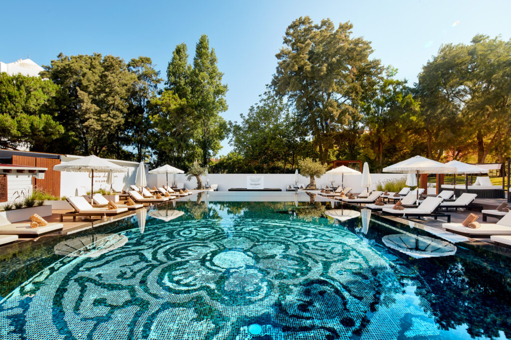 Outdoor pool with sun loungers at Tivoli Marina Vilamoura