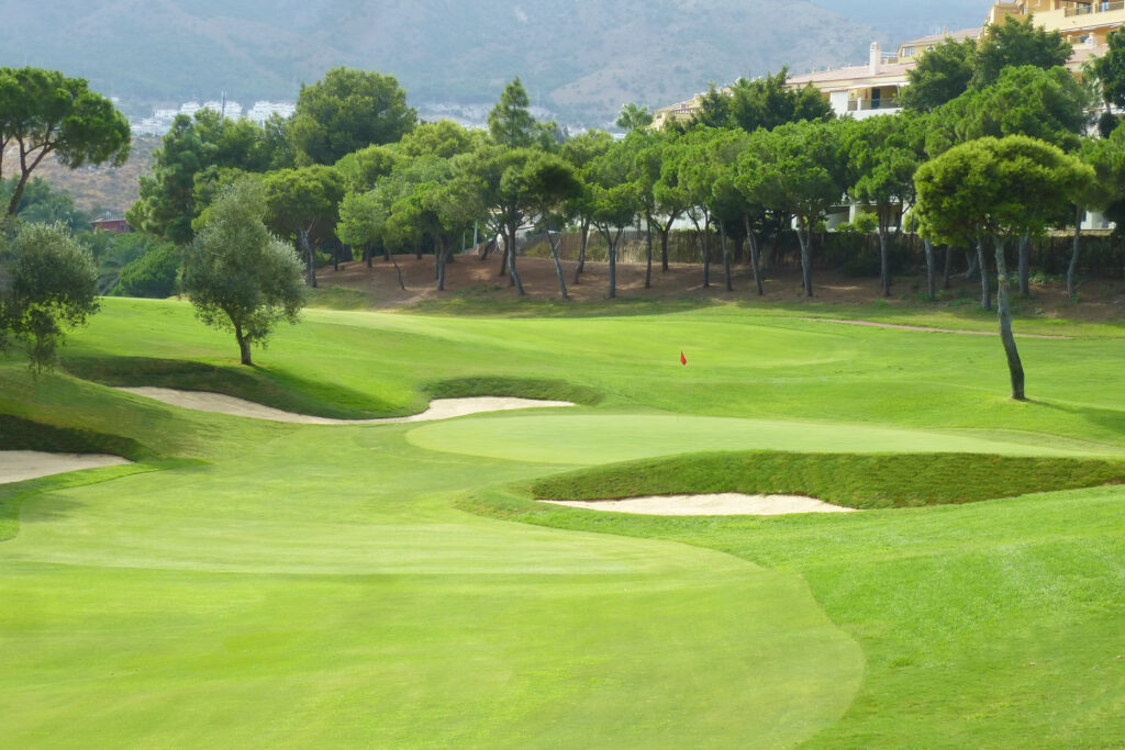 Hole with bunkers and trees around at Torrequebrada Golf Course