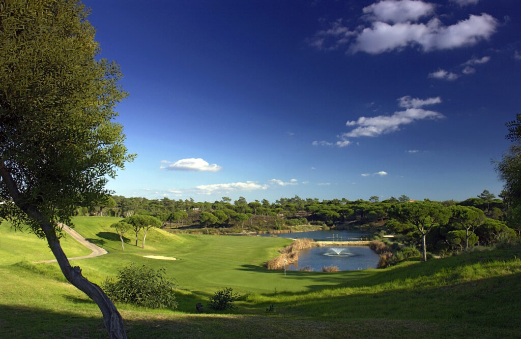 View of the fairway at Vale do Lobo Royal Golf Course with lake in distance