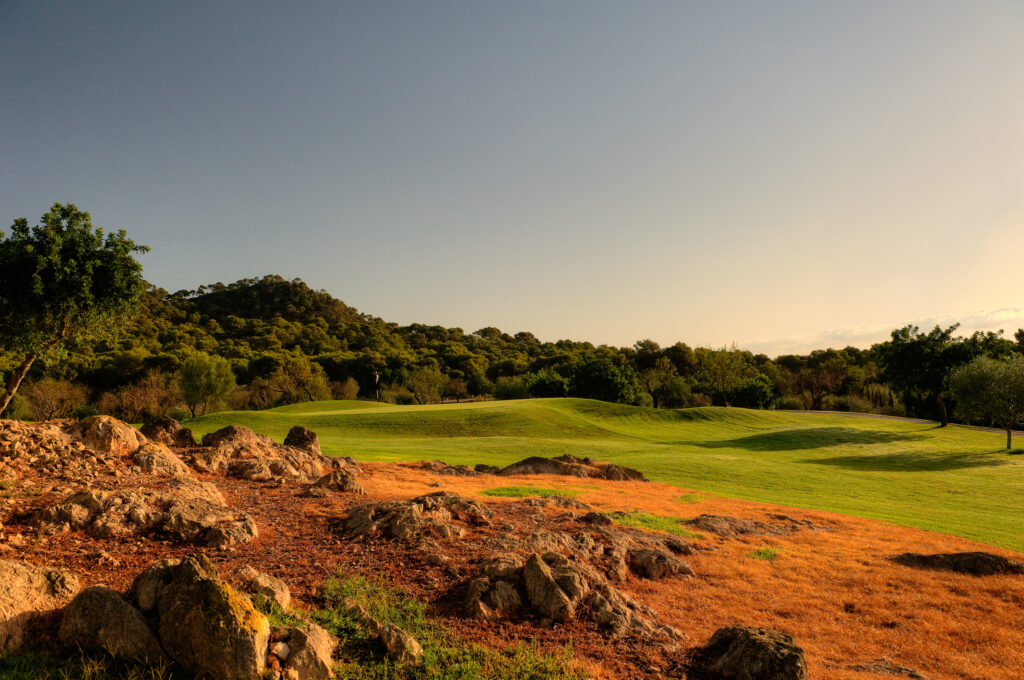 Fairway with stone and trees around at Vall D'Or Golf Course