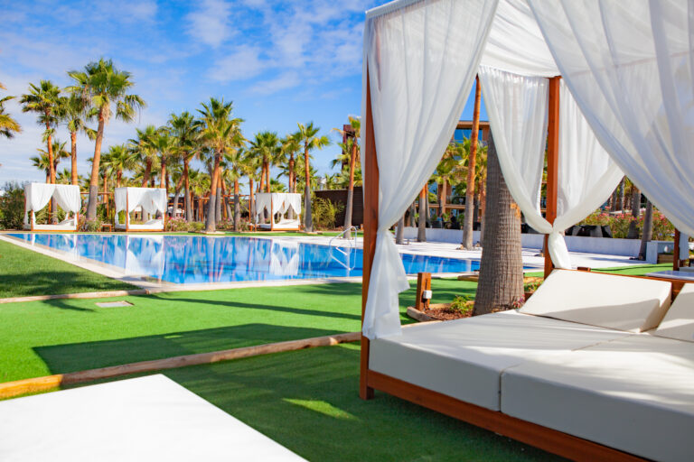 Canopy bed by outdoor pool at Vidamar Resort Hotel Algarve