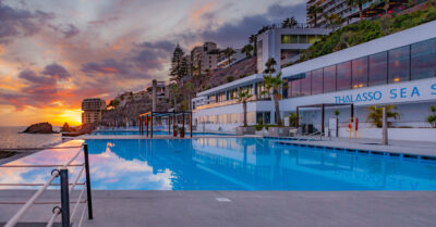 Outdoor pool at Vidamar Resorts Madeira at sunset