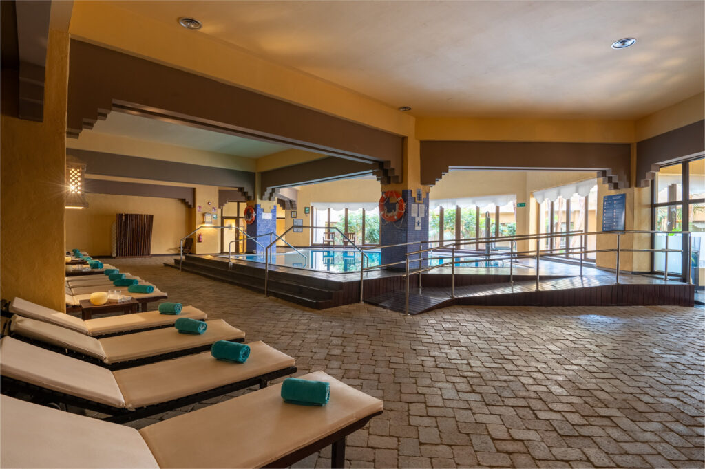 Loungers by indoor pool at Vila Gale Isla Canela