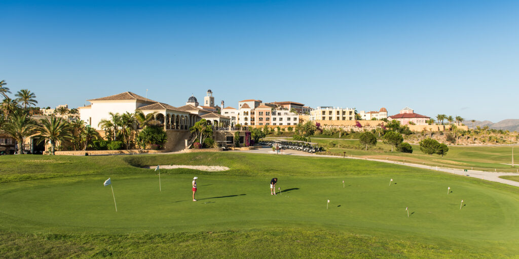 People practicing on the practice facilities at Villaitana - Levante Course