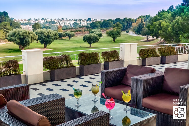 Outdoor seating area with drinks at Villamartin Golf Course