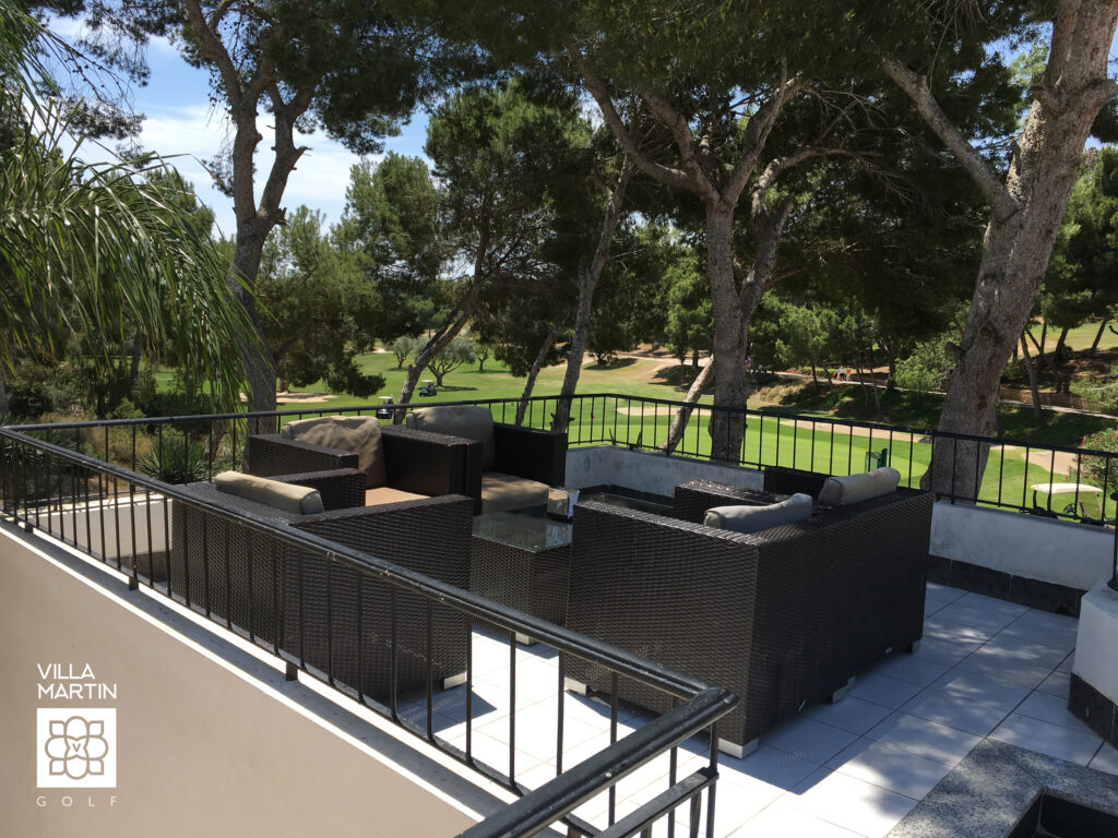 Outdoor seating area on a terrace at Villamartin Golf Course