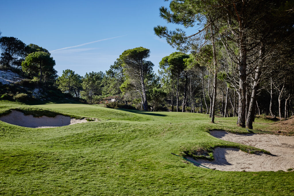 Bunkers on fairway with trees around at West Cliffs Golf Links