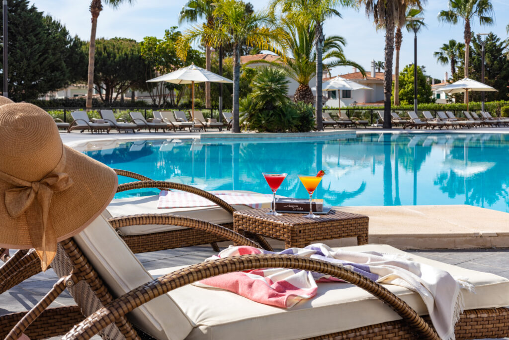 Outdoor pool with sun loungers at Wyndham Grand Algarve