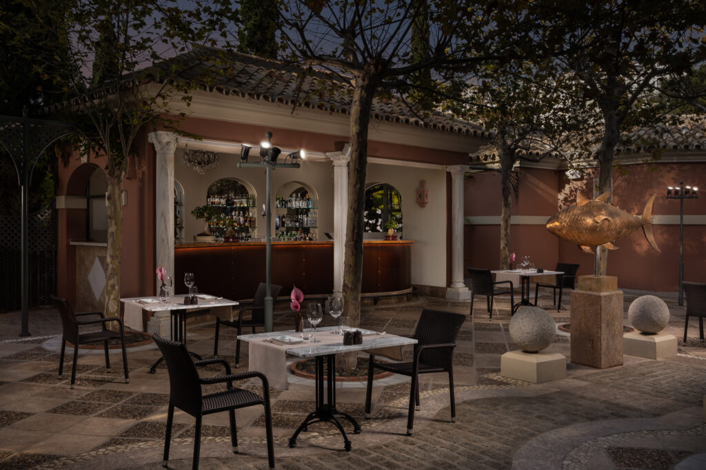 Outdoor bar and dining at Anantara Villa Padierna Palace Benahavis Marbella Resort