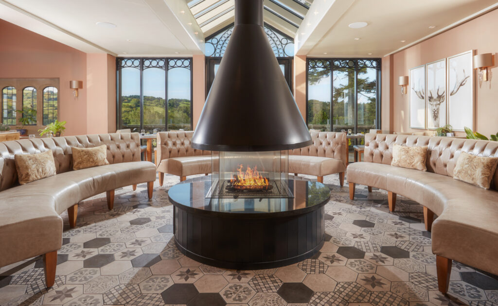 Indoor seating area with fireplace at Bovey Castle