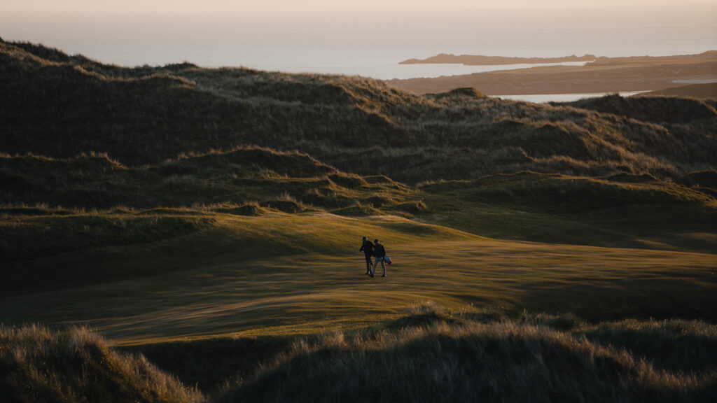 People walking along the fairway at Carne Golf Links