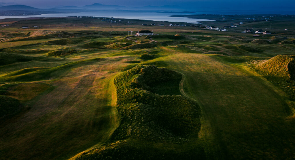 Fairway at Carne Golf Links with buildings in distance