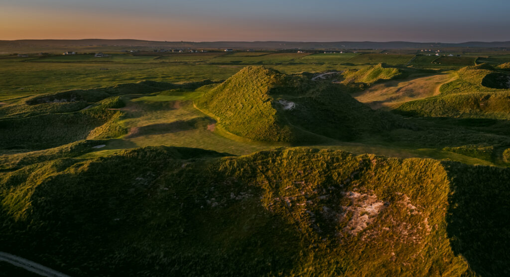 Fairway at Carne Golf Links with mounds around