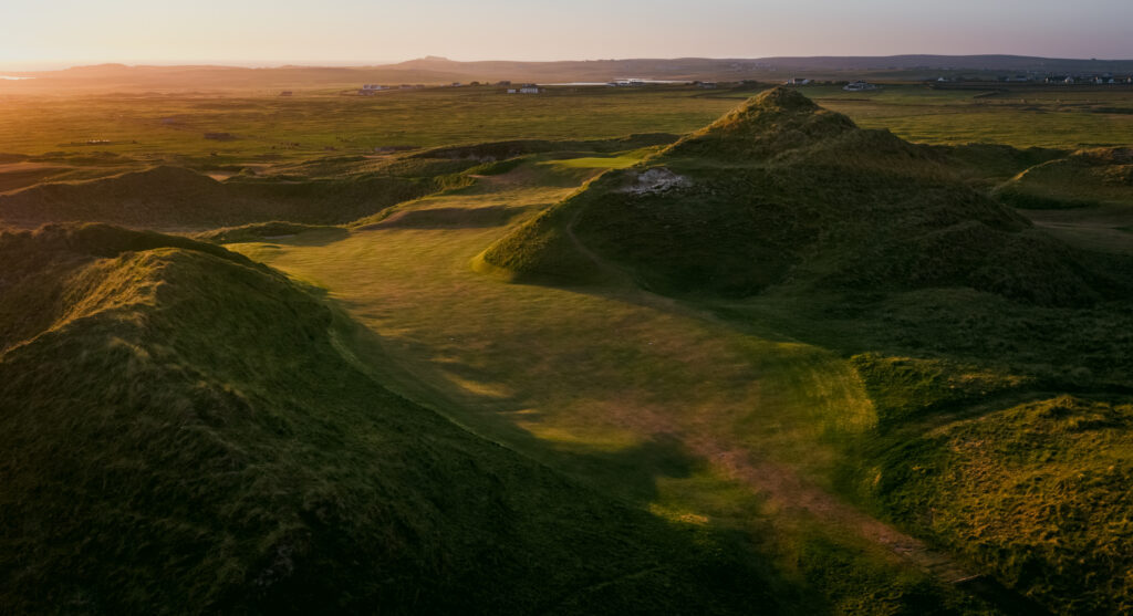 Fairway at Carne Golf Links with mounds around