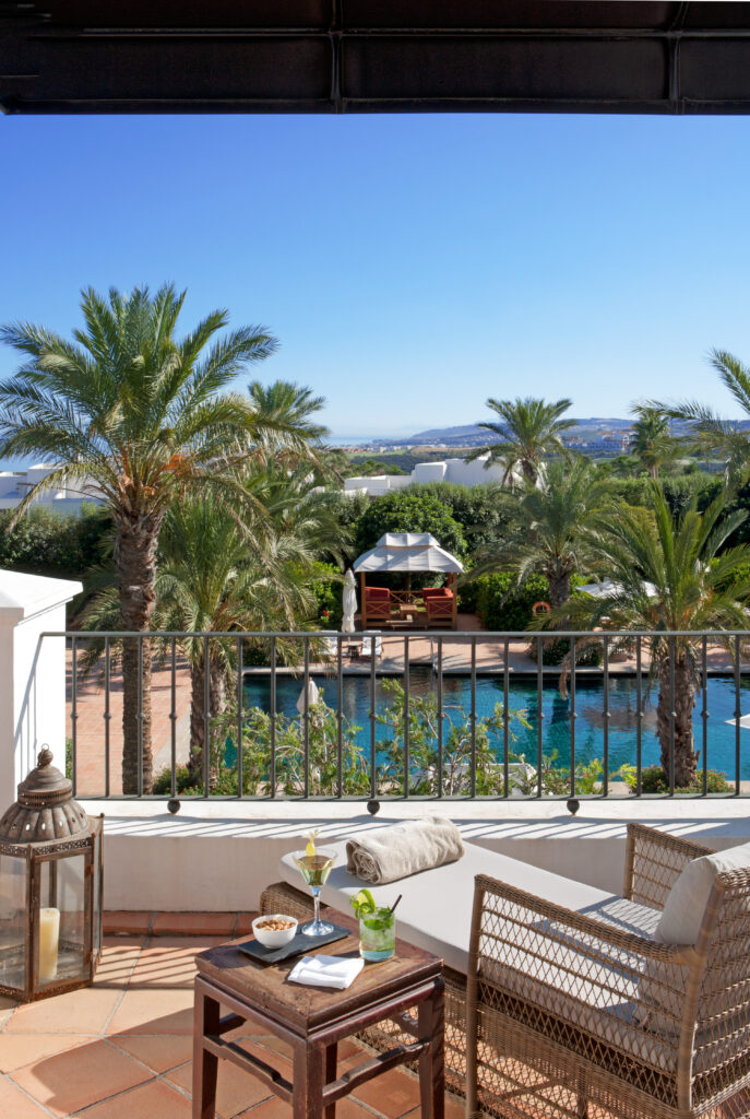 Balcony with view of outdoor pool at Finca Cortesin Hotel, Golf & Spa