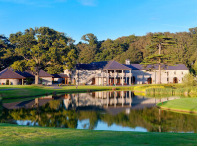 Lake on fairway at Fota Island - The Deerpark Course with building in background