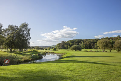 Fairway at Fota Island - The Deerpark Course with lake and trees around