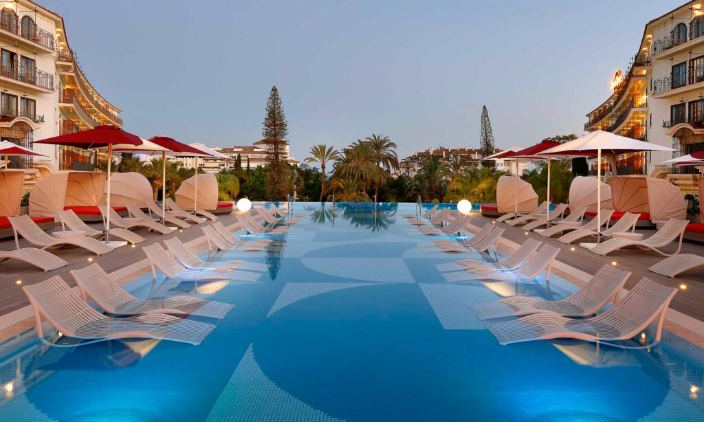 Outdoor pool with sun loungers at Hard Rock Hotel Marbella