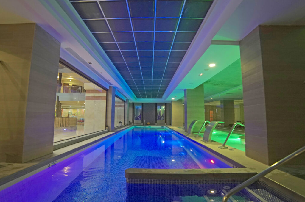 Indoor pool with led lights at Holiday Polynesia Hotel