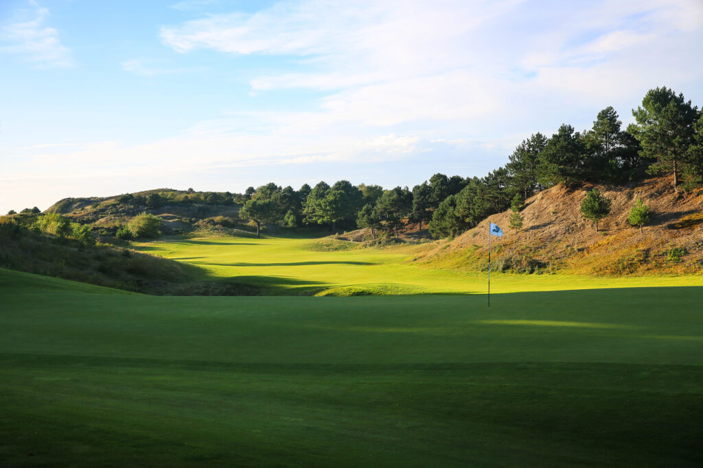 Hole at Belle Dune with trees around