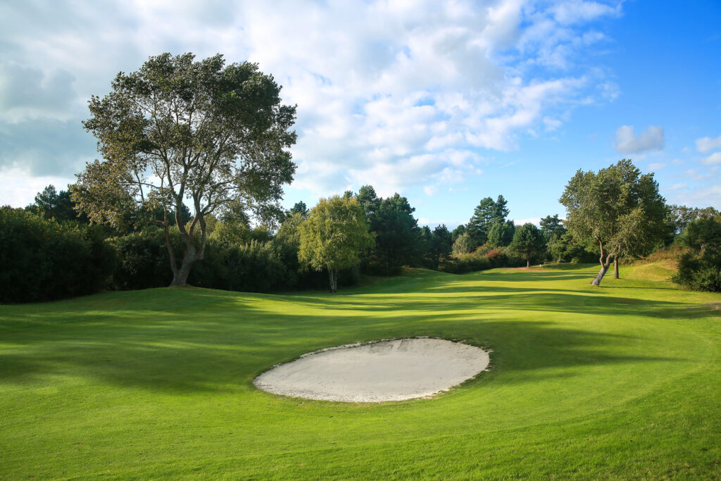 Bunker on fairway at Belle Dune with trees around