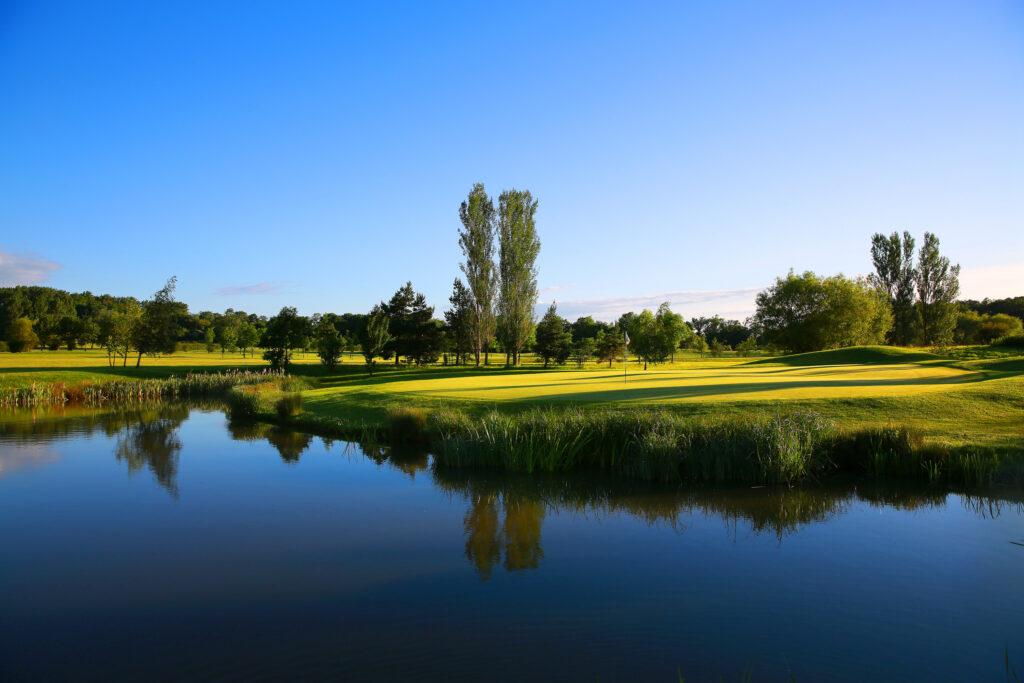 Lake on fairway with trees around at Belton Woods - Lakes Course