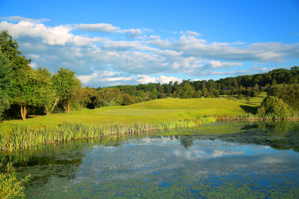 Lake on fairway with trees around at Belton Woods - Lakes Course