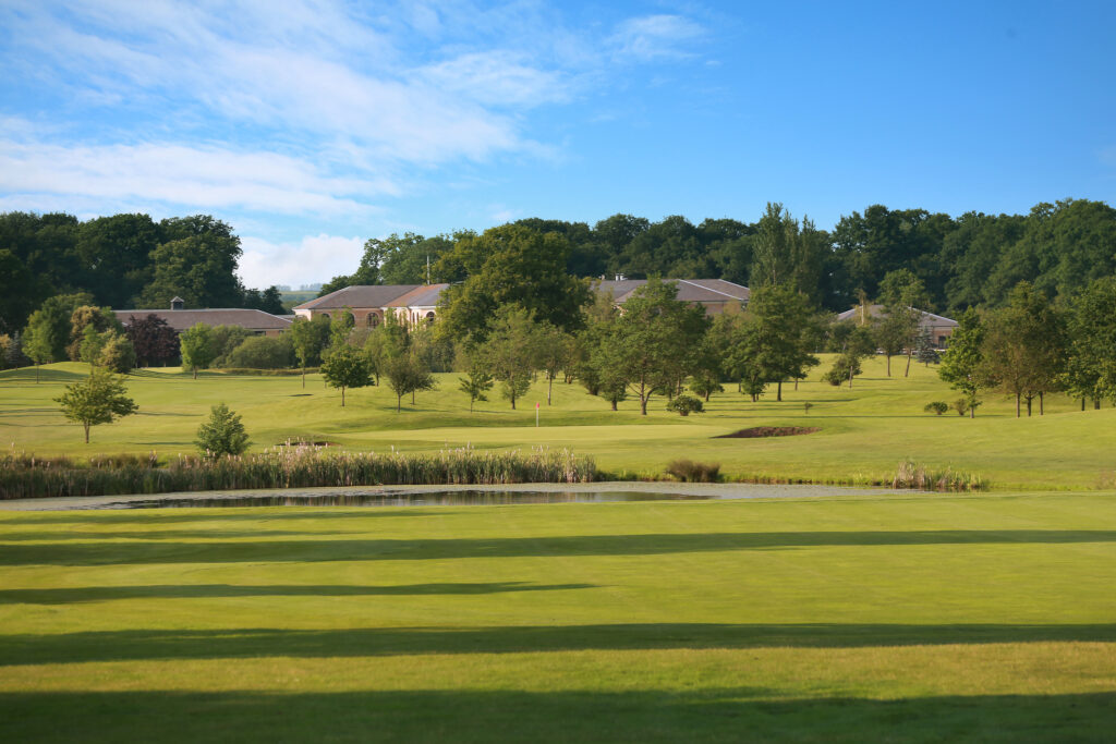 Fairway with lake and trees around at Belton Woods - Woodside Course