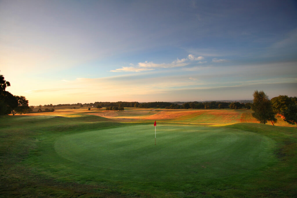 Hole with red flag at Breadsall Priory - Moorland Course