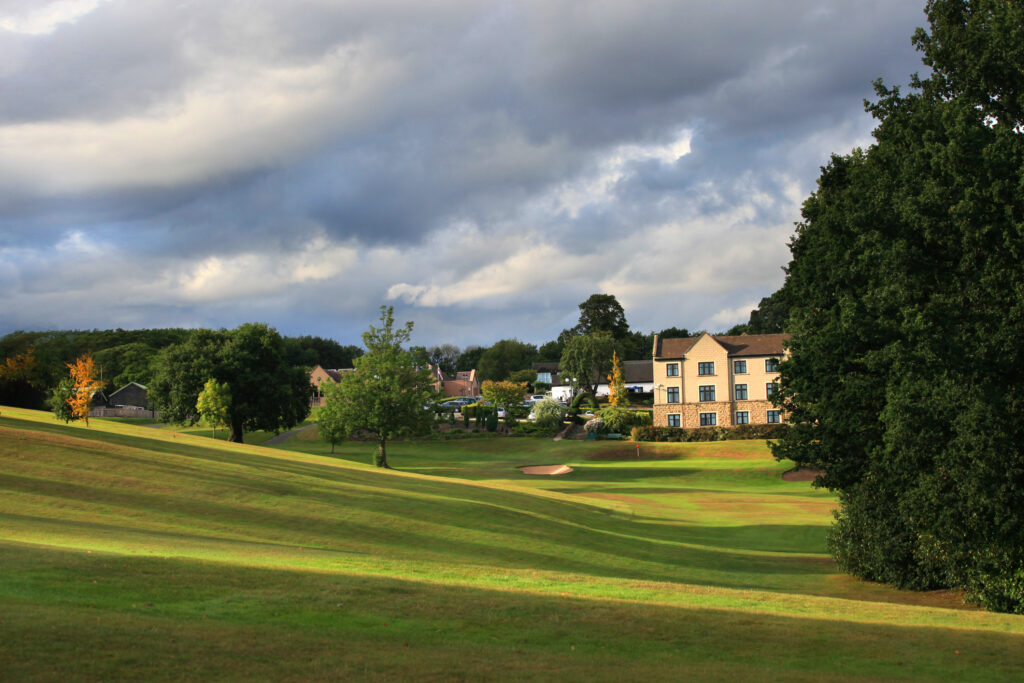 Fairway with trees and building in background at Breadsall Priory - Moorland Course